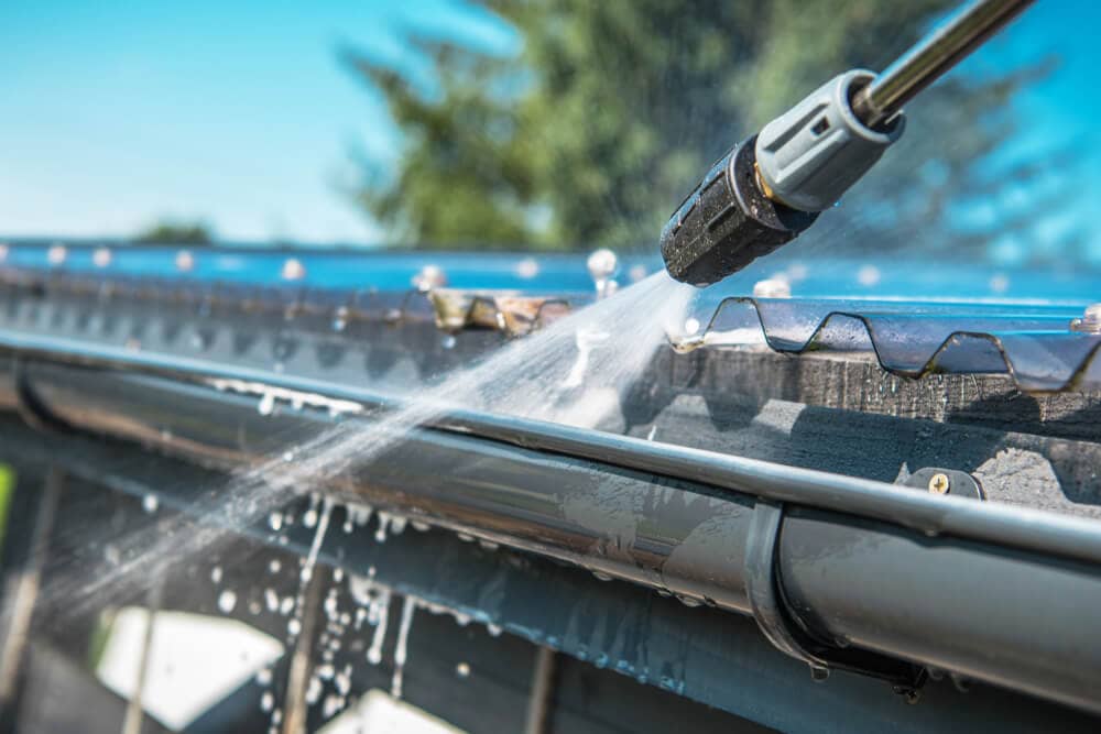 gutter cleaning using a power washer