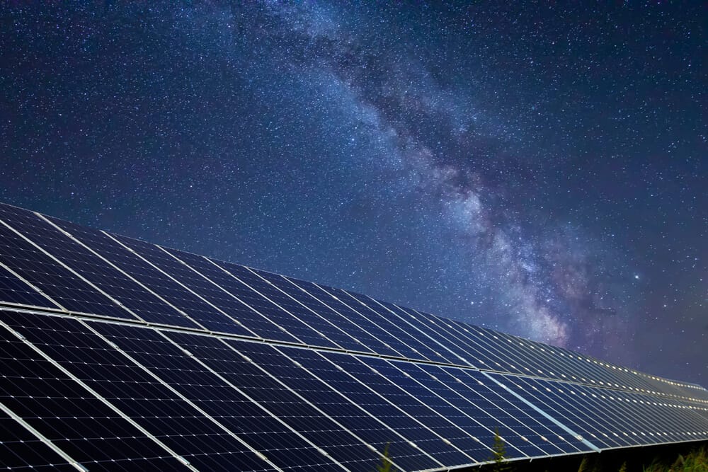 solar panels under a starry sky