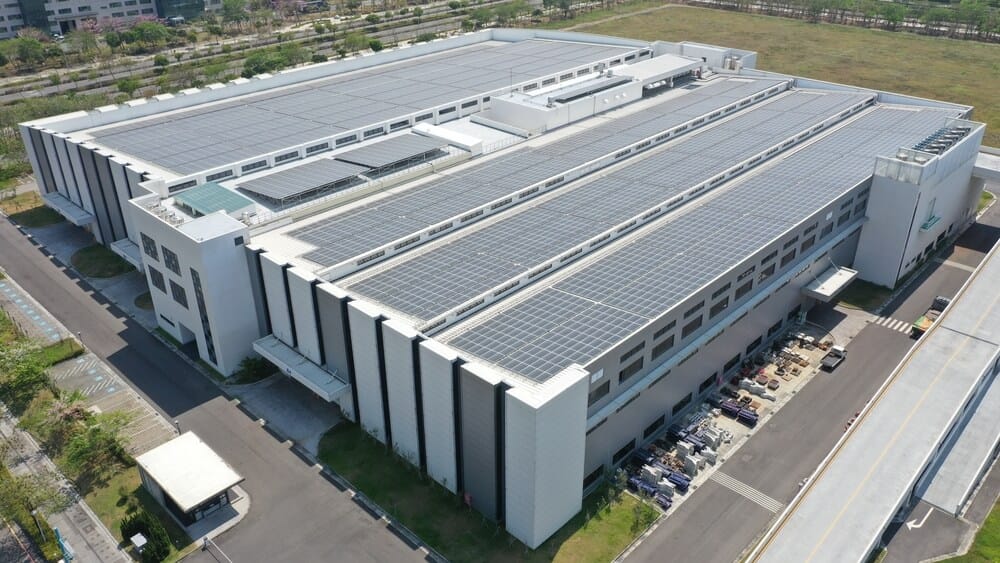 modern factory building with roof mounted solar panels