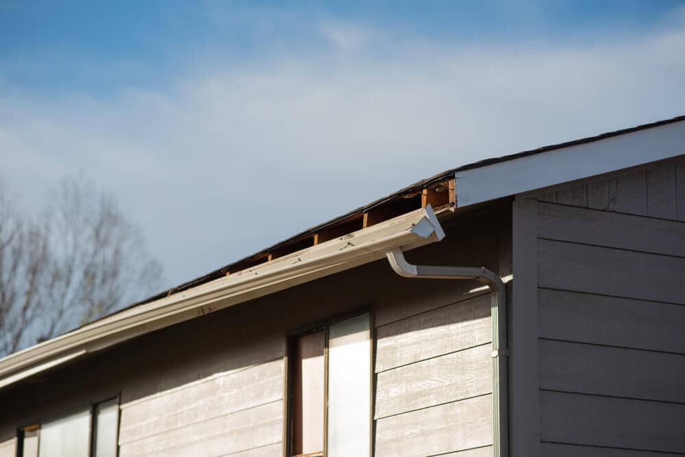 closeup view of gutter pulling away from roof