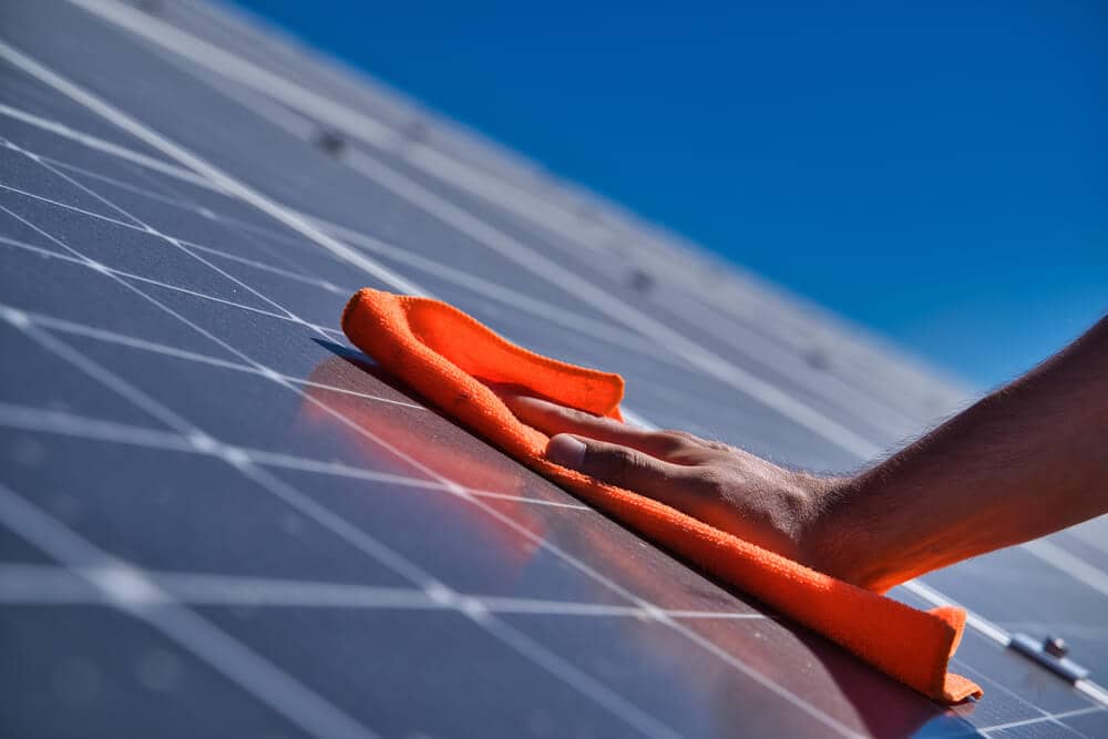 cleaning-solar-panels-on-roof-ksolara-solar-panel-cleaning-machines